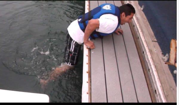 BPI technician Jesse going "underwater" to check for a dock-side leak at the Sheraton Marina Hotel.