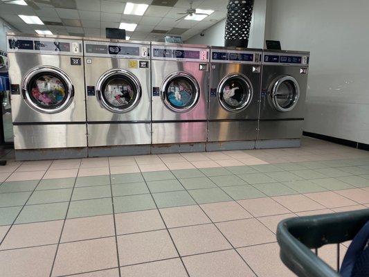 4 washers full of clean clothes waiting for the owner to come get them to be dried. It's been a little over an hour.