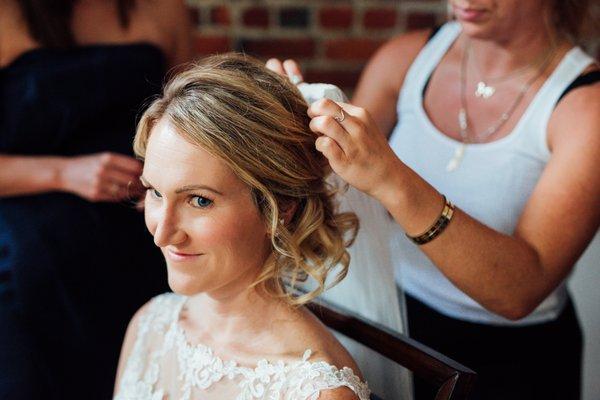 Jackie Mello--after completion of hair helping to pin the veil.