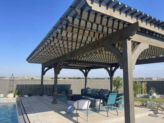 Poolside pergola with tinted polycarbonate roof