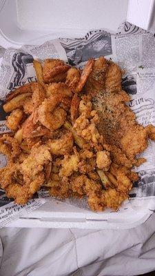 Seafood platter with fish, shrimp, conch and fries.