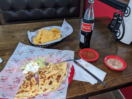 Tasty Asada quesadilla, a REAL Coke and wonderful bean and salsa dips. Chips are crispy. Excellent lunch.