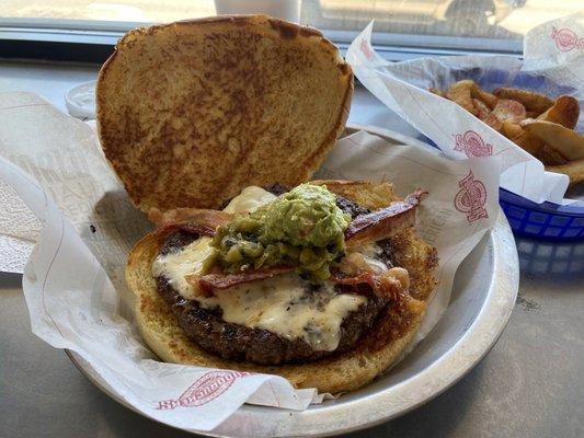 This is the 1lb southwest burger with green chile. The bun is huge and makes the burger look small but it's big. Pretty bland though.