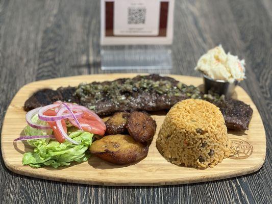 Churrasco with yellow rice and maduros.