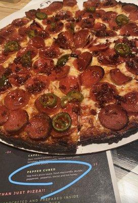 Pepper cured pizza on cauliflower crust