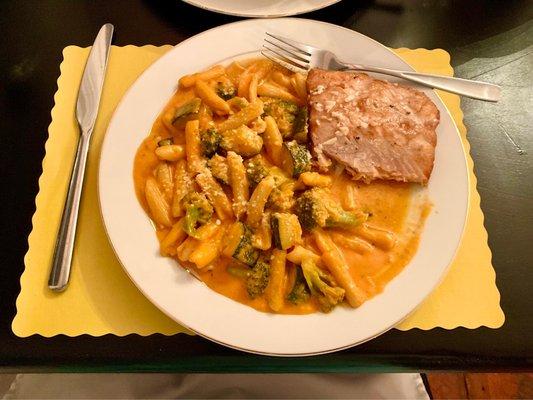 Pasta/zucchini/broccoli in a vodka sauce with salmon.