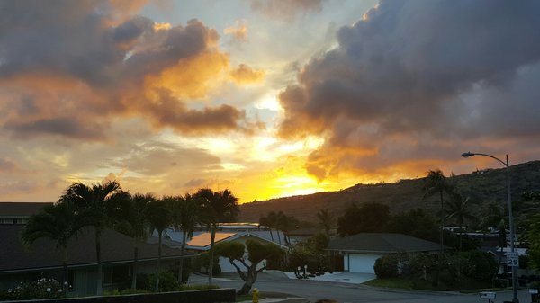 Beautiful sunset lighting the sky orange around the Bay Club