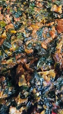 Efo riro (stewed spinach with assorted meat).  It can be served with any choice of fufu, rice, plantains, or eaten by itself.