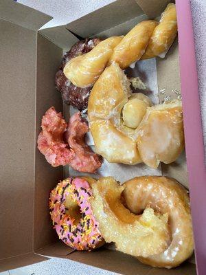 Strawberry frosted, strawberry cake, strawberry fritter, glazed, sour cream, cronut, and twist glazed.