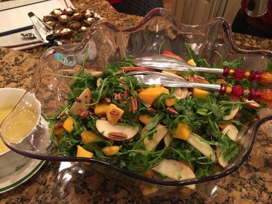 Arugula with apples, mangoes, oranges and toasted pecans