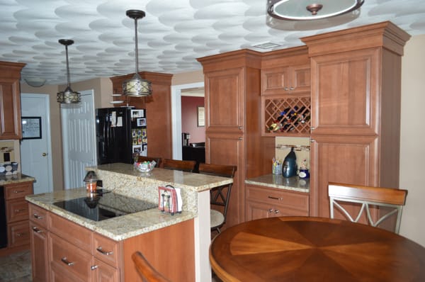 Wolf Classic maple cabinetry in Attleboro has loads of storage and warm tones. Designed and Installed by Attleboro Kitchen and Bath.