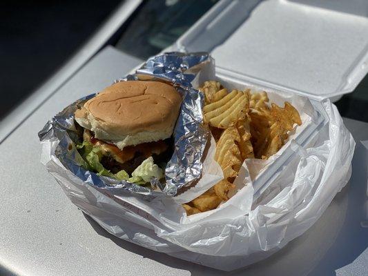 Fully dressed burger with bbq sauce and old bay French fries!