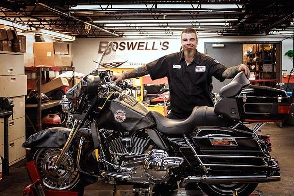 Mechanic repairing a Harley. We captured this image in Nashville at the Boswell's Harley Davidson shop.