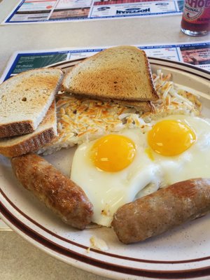 2 eggs over easy with hasbrowns and sausage links.