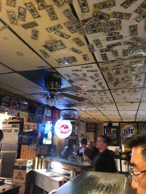 Old fashion bar with dollar notes.