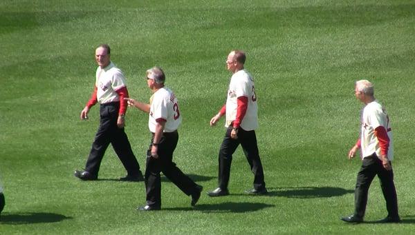 Me and two of my old teammates as we walk across the outfield at the Fenway 100th Anniversary