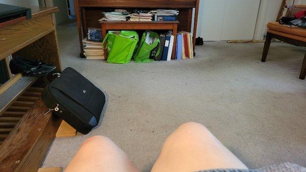 You can see that my left knee is much higher than my left one, while the piano across the room is level.