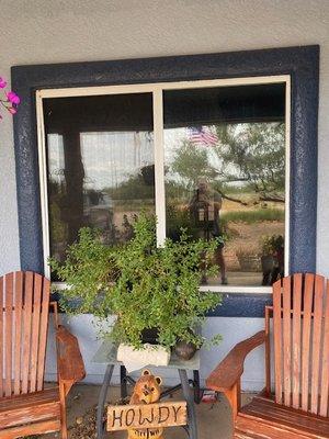 Looking from outside on the porch into the living room window