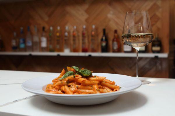 Penne alla Vodka - Creamy pasta with flambeed shrimp in vodka, petit pois and aurora sauce