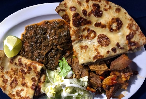 Malawax canjero with goat meat, lettuce and spinach!!! This meal will have you coming back for more.