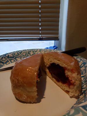 Sliced raspberry donut