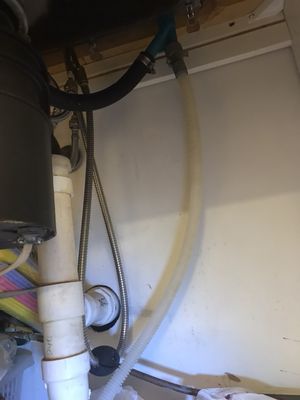 Air gap with dishwasher drain hose connections.