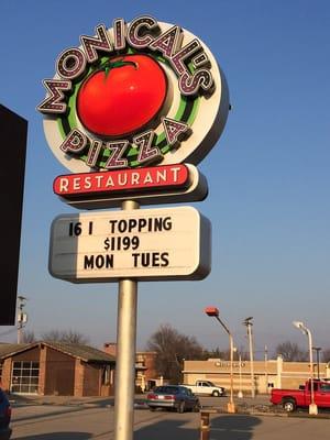 The sign out front Monicals in Paris.