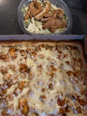 Buffalo chicken pizza and crispy chicken Caesar salad.