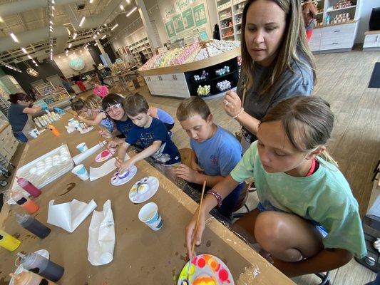 Kids can paint a bath bomb for free.