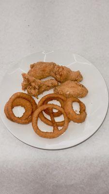 Halal fried chicken wing meal with onion rings