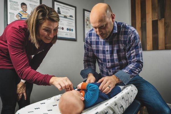 Performing an abdominal assessment for children that suffer from colic, constipation, gas, bloating to improve their digestion.