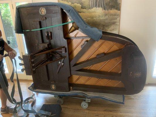 Photo 5: Detail of bottom of Steinway showing pedal lyre box attached.