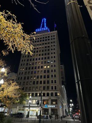 The Walker building, and the weather will be sunny tomorrow.