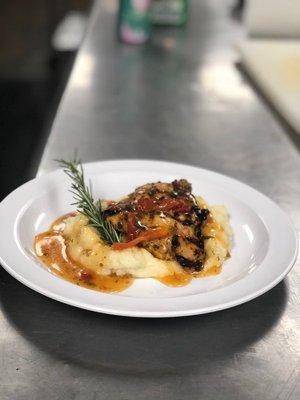 Grilled Rosemary Chicken Breast with Sundried Tomato. Served on a bed of Garlic Mashed Potato.