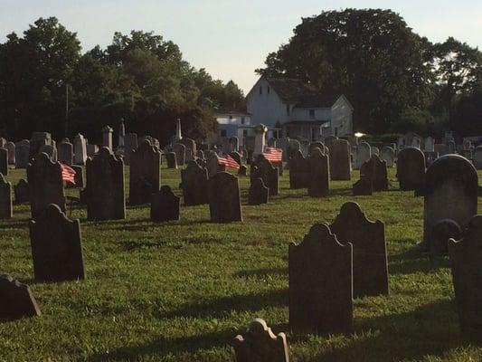 View of older gravestones & caretaker home