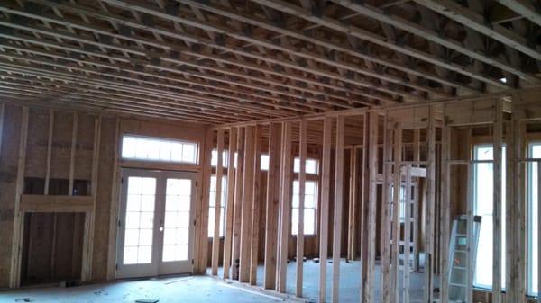 2 story house construction before walls and ceilings are insulated.