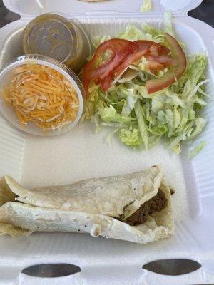 Single shredded beef taco on corn tortilla