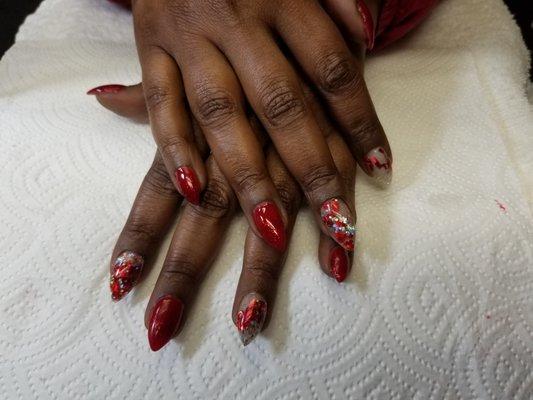 Red short stilleto nails.