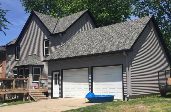 This recently sided house features Harbor Grey siding with black trim.