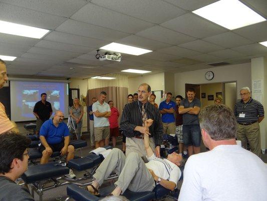 Teaching Chiropractors how to adjust the shoulder.