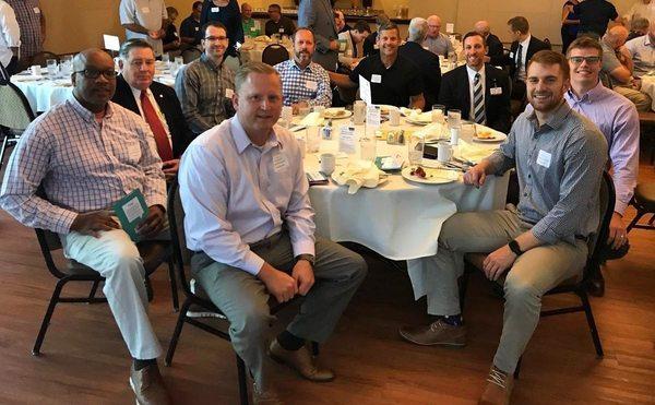 The TIG Advisors table at a local fundraising breakfast for True North of Columbia.