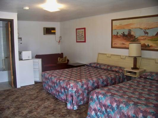 We have rooms with one bed or two beds.  We have a mini-fridge and microwave in each room.