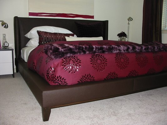 Custom made headboards and beds.
 Also makes bedding and pillows.