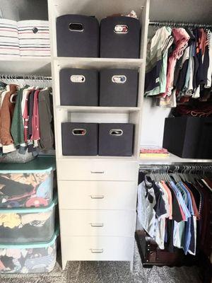 Dresser, laminate countertops, and hanging rods.