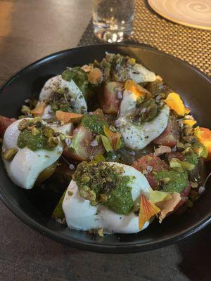 House-Made Fresh Mozzarella -- prepared with heirloom Jersey tomatoes, pistachio and pesto!