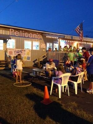 Friends and family enjoy a summer night at Pelican's SnoBalls in York, SC.