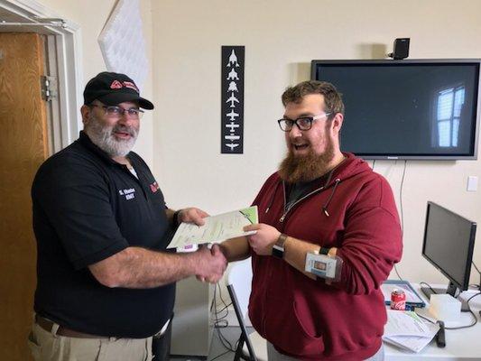 John Canada receiving his Emergency Medical Responder (EMR) certification.