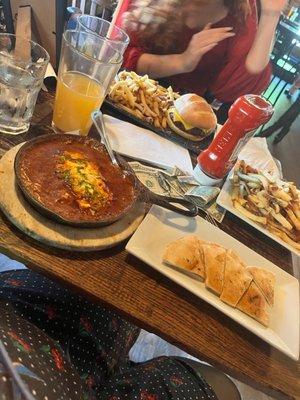 Shakshuka with garlic pita and an order of fries