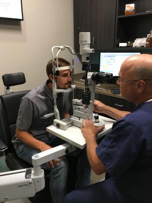 A Patient getting an eye exam and new eye glasses at Dr. Zoellner's new office in Tulsa!