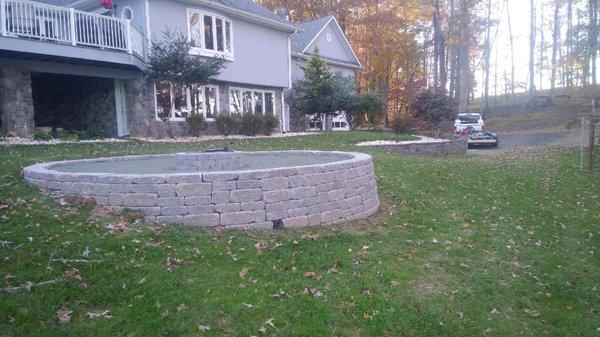 Dan also does great landscaping work. Hbuilt this fire pit area to match our existing landscape wall. It looks great!!